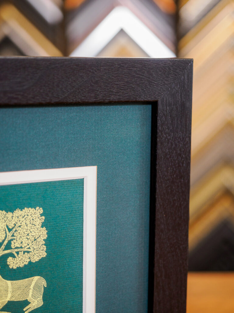 Logo illustration framed with walnut frame and layered mats in San Francisco