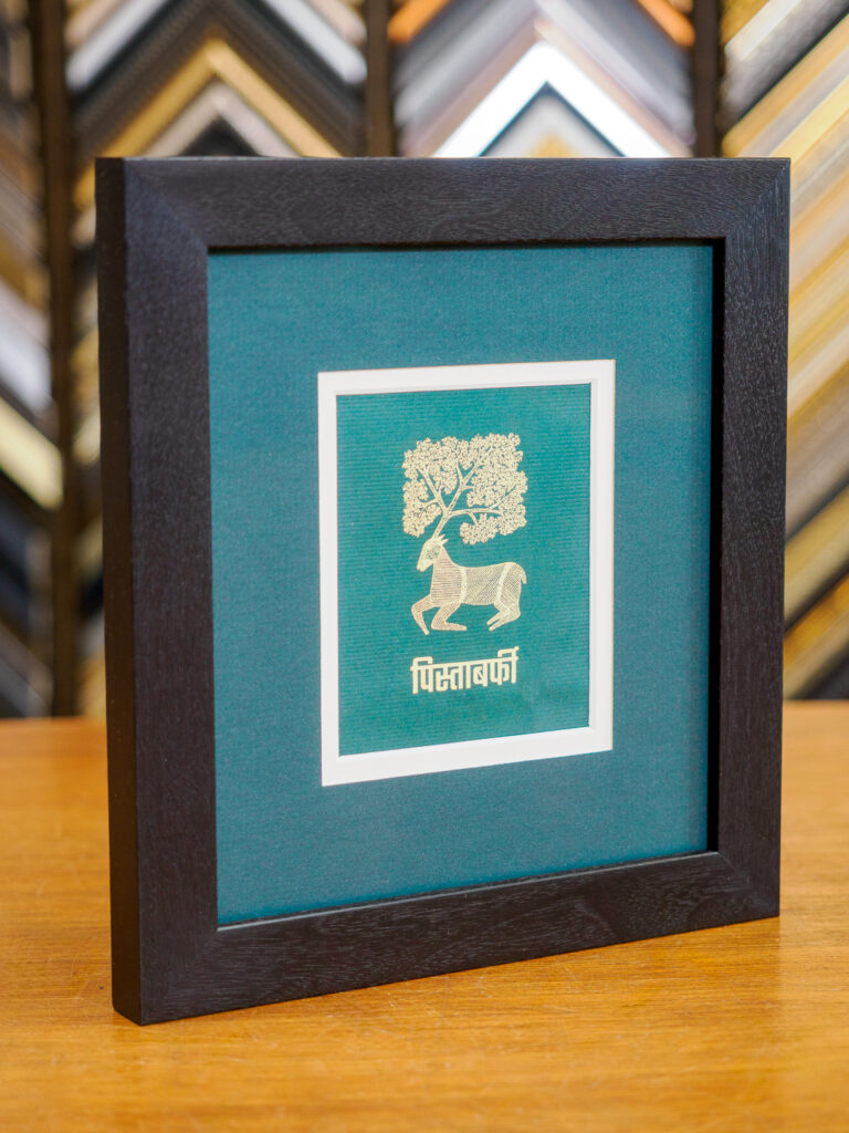 Advertising illustration framed with walnut frame and layered mats in San Francisco