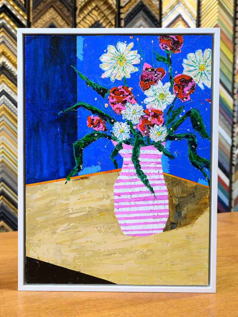 Still life canvas painting framed in a white floater frame at Underglass Custom Picture Framing in San Francisco

