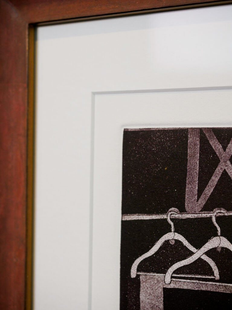 Close-up of 8-ply vellum mat and weathered rust scoop frame with gold edges, custom picture framing Castro San Francisco
