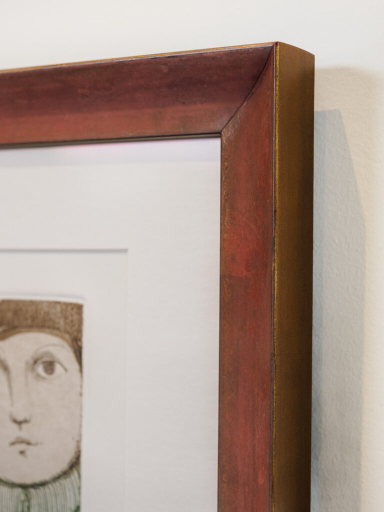 Close-up of 8-ply vellum mat and weathered rust scoop frame with gold edges, custom picture framing Castro San Francisco