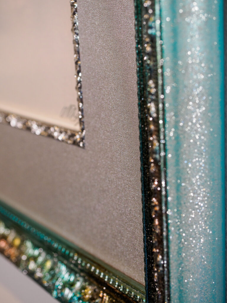 Close-up of multicolor glitter frame and silver fillet detail,
Underglass custom picture framing Castro San Francisco
