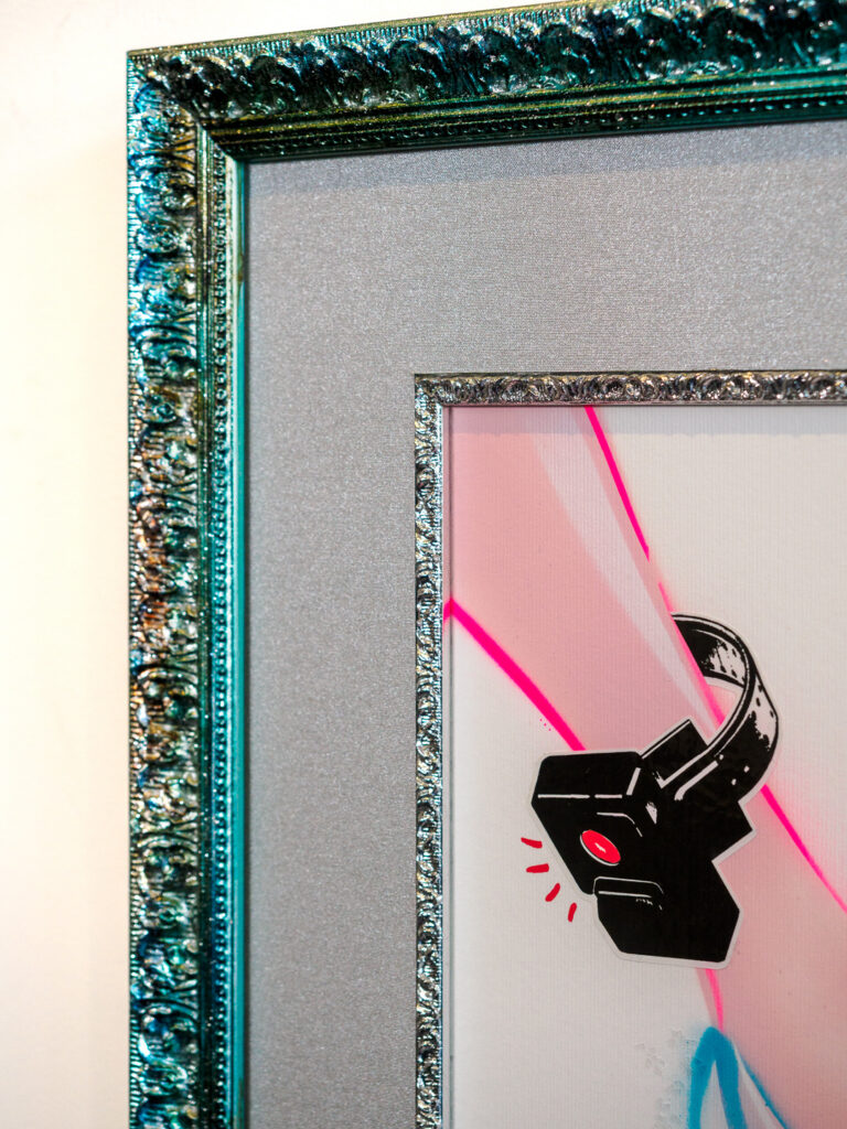 Close-up of multicolor glitter frame and silver fillet detail, custom picture framing Castro San Francisco