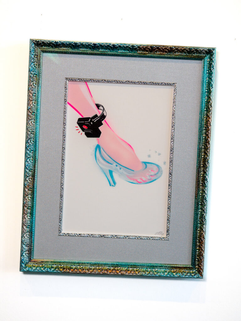 Custom framed SINNER ELLA'S FOOTPRINT by Mark Denton Esq in multicolor glitter frame with silver fabric mat, Castro frame shop San Francisco