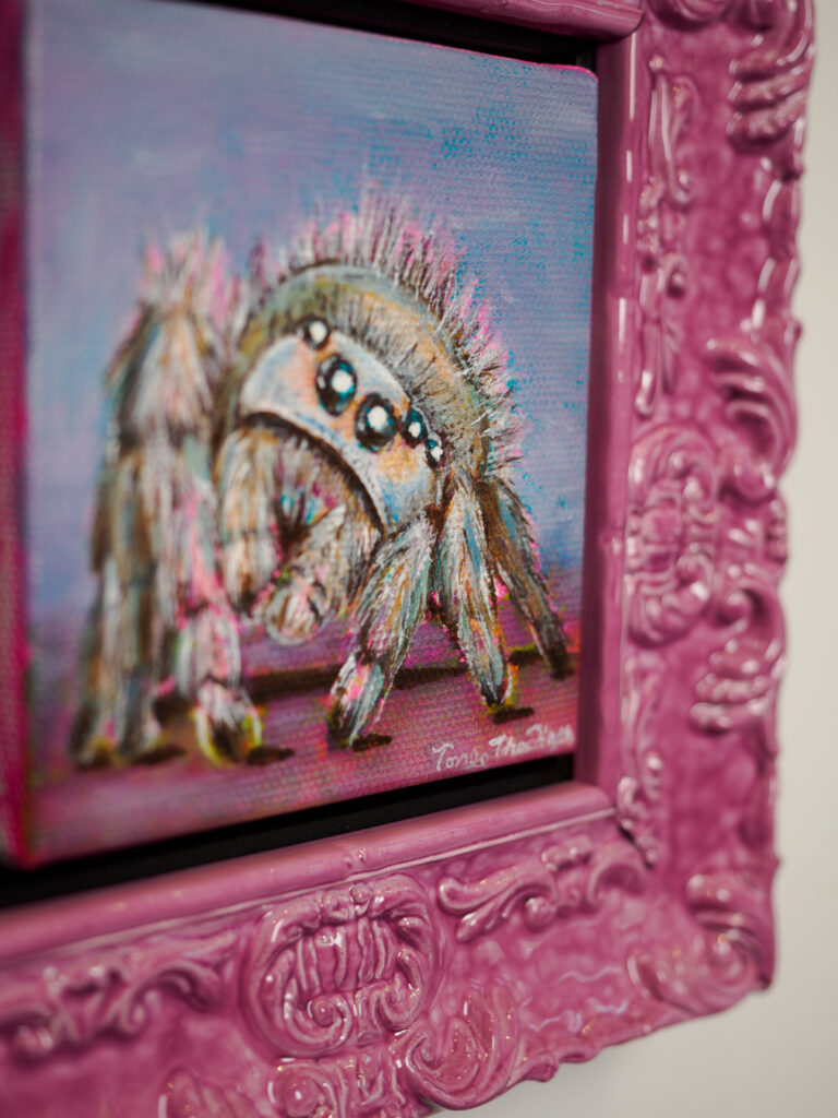 Close-up of pink lacquer ornate frame detail, colorful custom picture framing San Francisco Underglass
