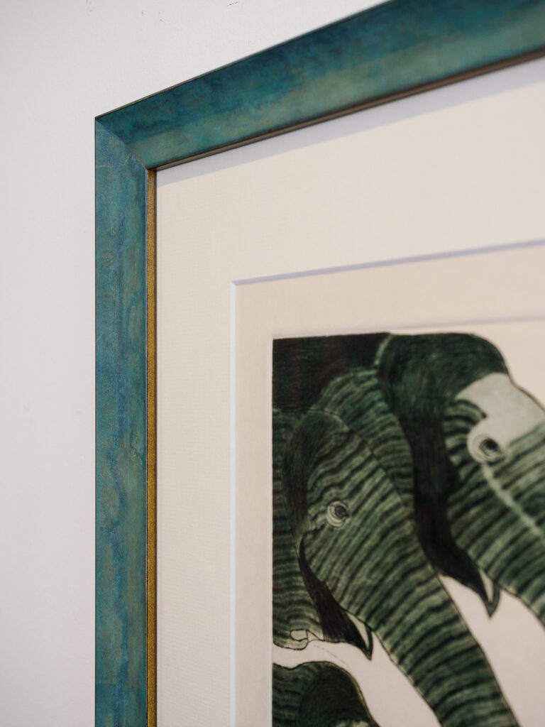 Close-up of wide off white beveled mat showing plate mark on Tarragó etching, custom picture framing San Francisco Underglass

