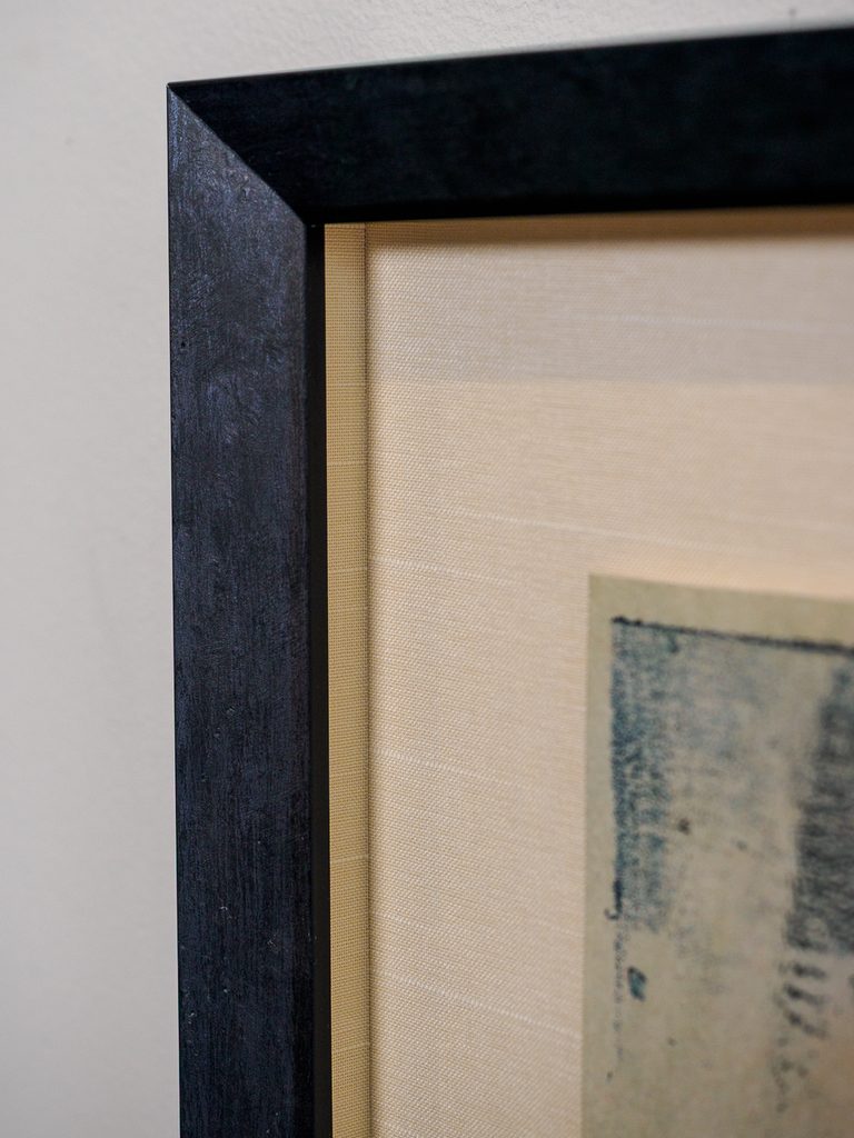 Close-up of float-mounted print on golden silk mat inside shadowbox, custom conservation framing Castro San Francisco