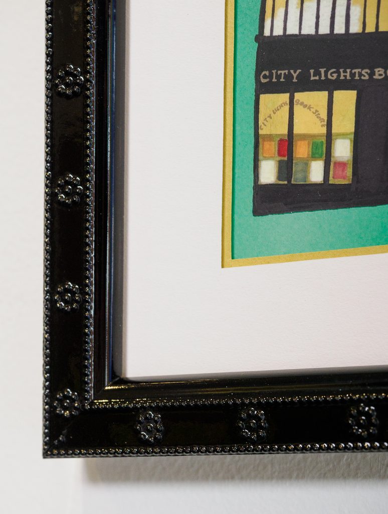 Close-up of angled frame corner cut on City Lights Bookstore painting, custom picture framing Castro San Francisco

